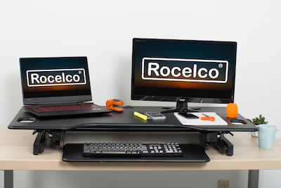 Rocelco 46"W 5"-20"H Large Adjustable Standing Desk Converter with AC USB Charger Dual Monitor Stand, Black (R DADRB-46-DMS)